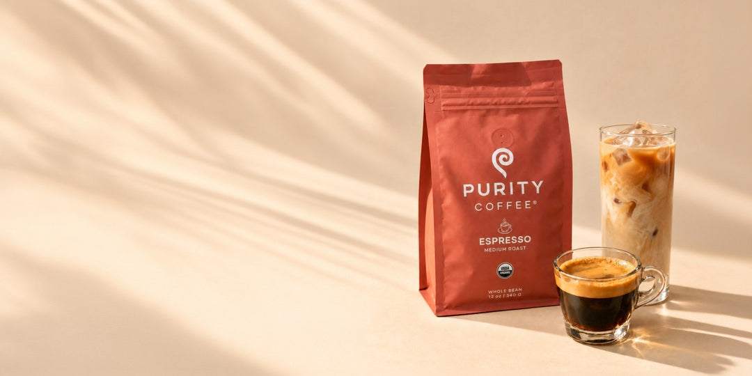 Purity Espresso Roast bag beside a shot of espresso and an iced latte