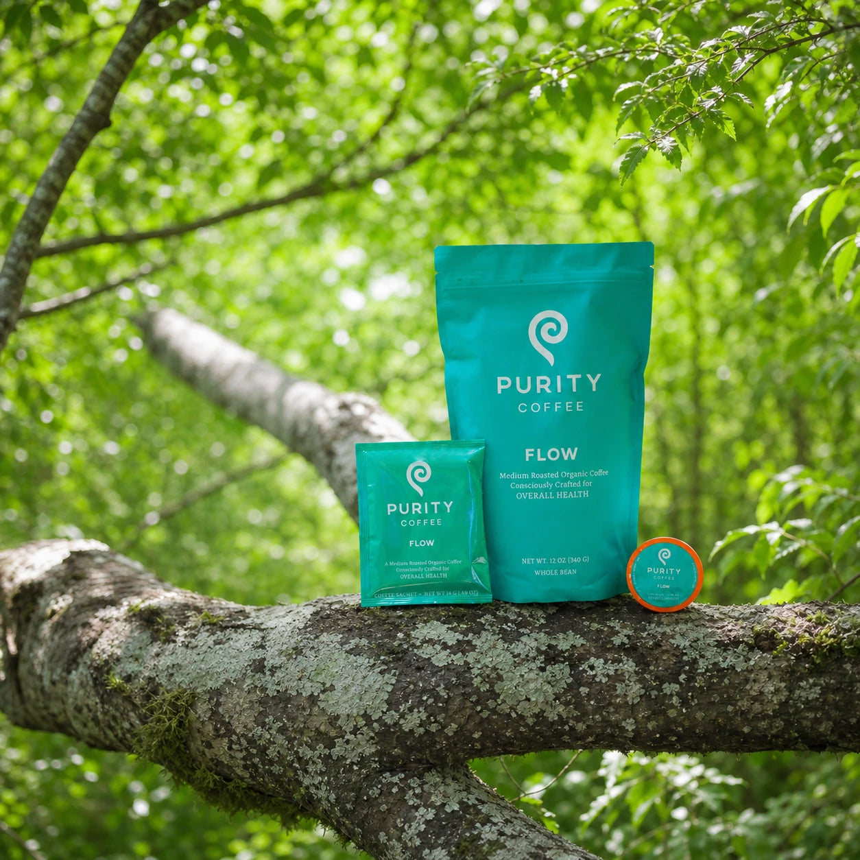 FLOW coffee packages surrounded by green leaves